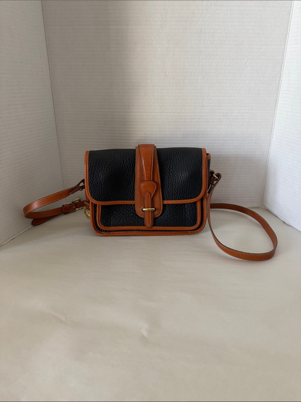 Dooney & Bourke Black Pebbled Leather Crossbody with Brown Trim